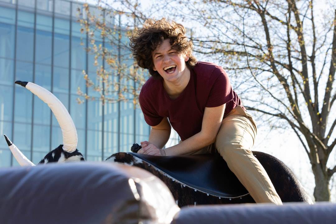Student smiling on the bull ride